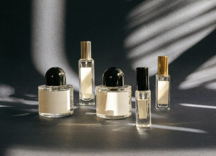 A group of perfume bottles sitting on top of a table